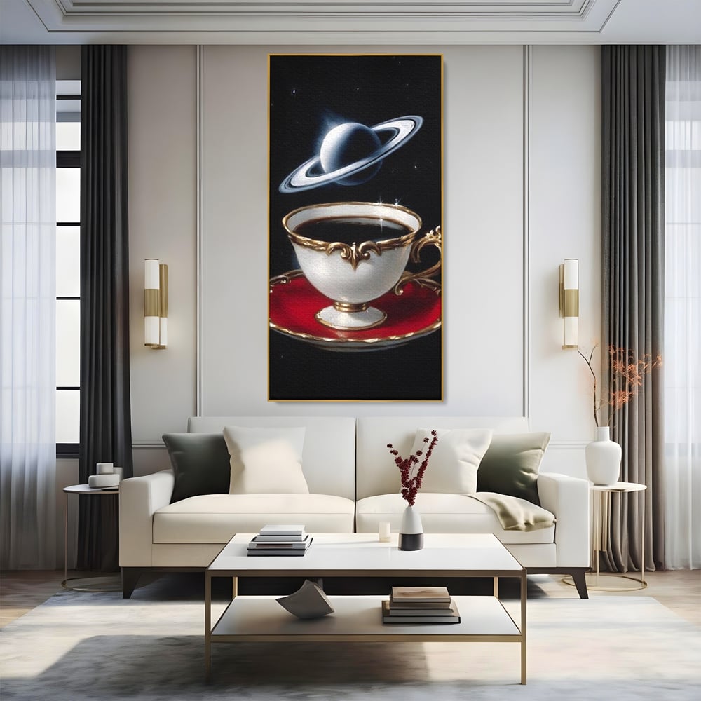 Tablou canvas cu tablou canvas cu ceasca si planeta, in rama de aluminiu auriu, pe perete intr-un living